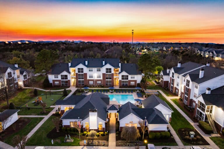 The Reserve at Harper's Point apartments sunset over the pool.