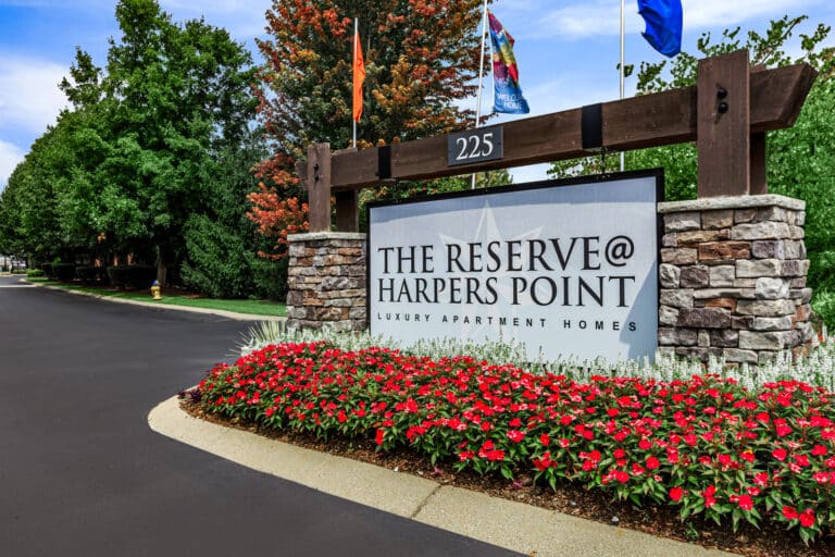 The Reserve at Harper's Point apartments front entrance sign.