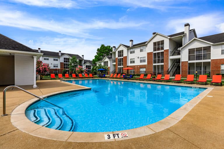 The Reserve at Harper's Point apartments pool area with plenty of lounge chairs.