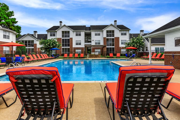 The Reserve at Harper's Point apartments pool with lounge chairs.